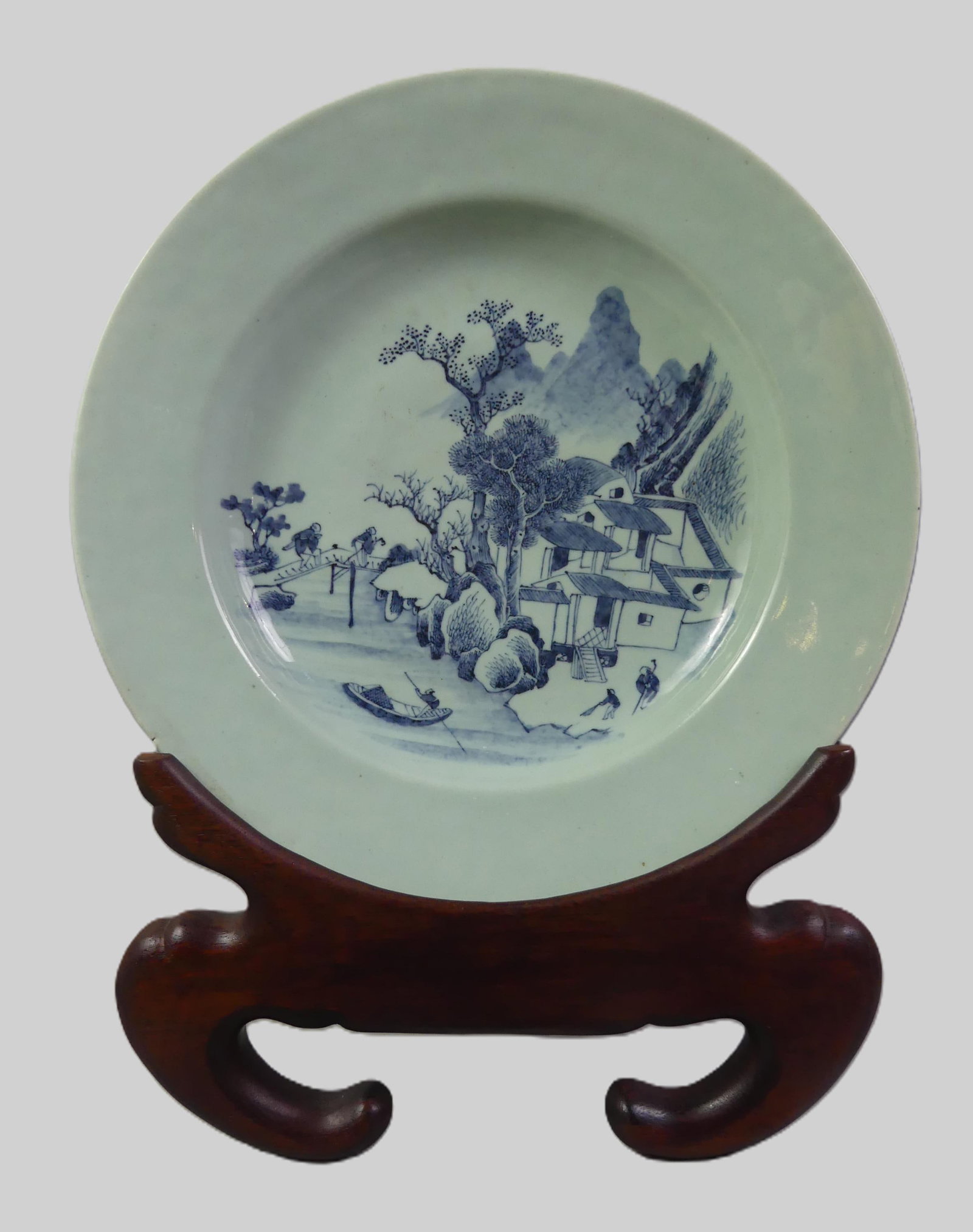 19TH C. CHINESE CELADON CHARGER - SCENIC: 19th century Chinese celadon chargeon with blue landscape having scenic design with figures. Signed with 4 character mark. On hardwood carved stand. 14.5 in diameter. Few minor rim chips.