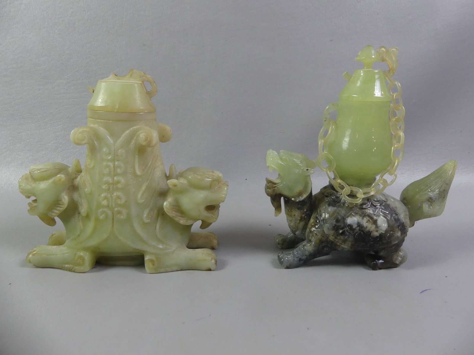 2 CHINESE JADE INCENSE BURNERS: Lot of 2 antique Chinese jade incense burners to 6.5 in high: 2 color turtle dragon with chain on cover (chip to lid); and 2 headed dragon (chips on lid)