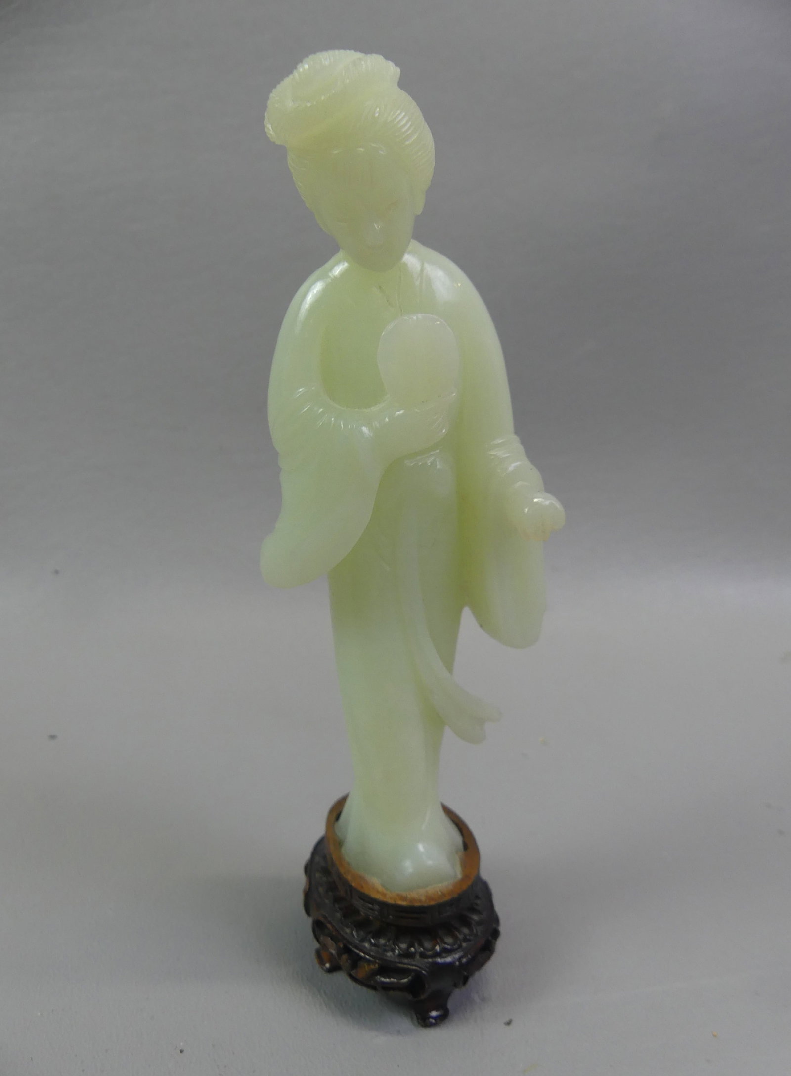 JADE FIGURE OF WOMAN WITH FAN: Old Chinese jade figure of an Asian woman holding fan, mounted on wood base. 6.5 in tall.