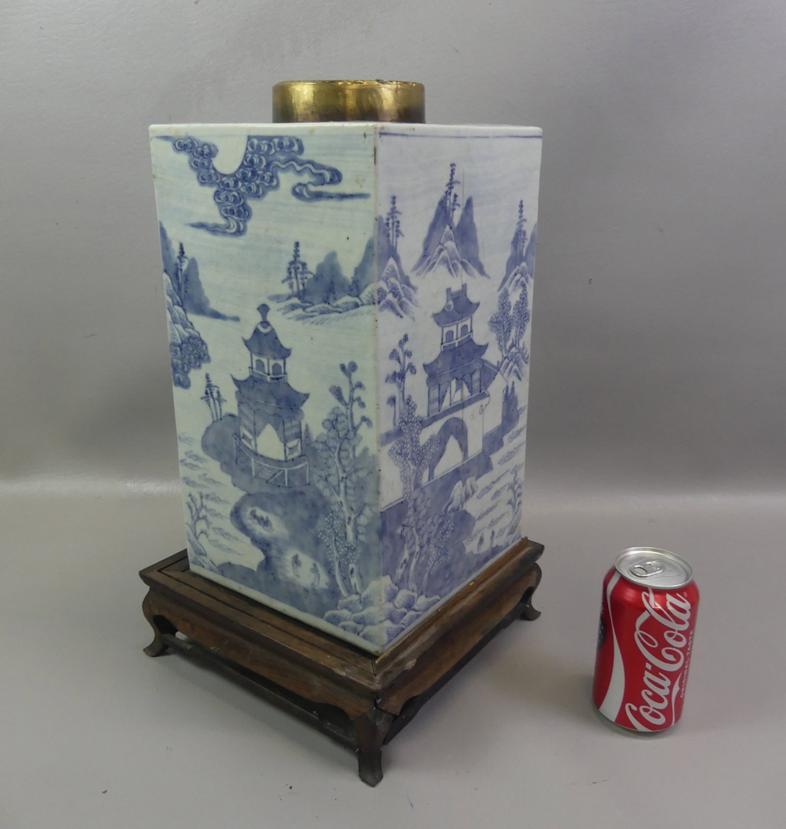 LARGE ANTIQUE CHINESE TEA CANISTER: Large 19th century Chinese blue and white porcelain square tea canister with painted decoration of temples and landscapes. 14 in tall plus 3 in wooden base. No cover, has chip in lower corner and 10 i
