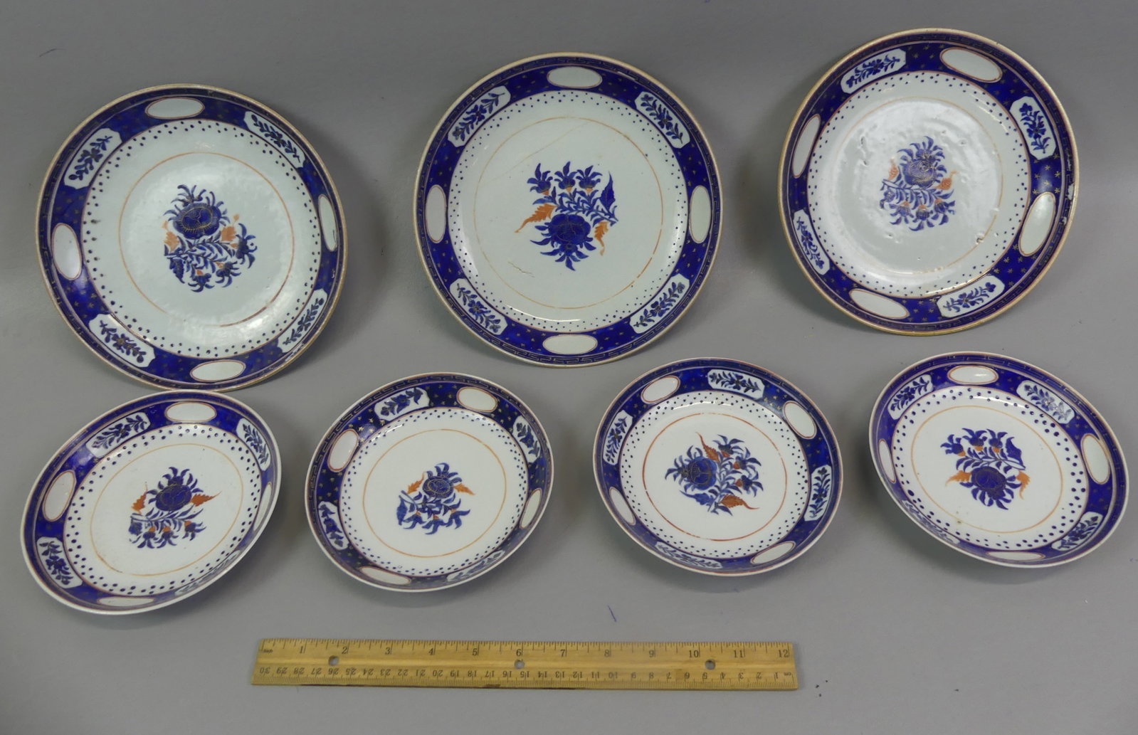 7 PCS CHINESE QIANLONG BOWLS: Group of 7 pieces of 18th century Chinese Export Qianlong dinnerware with cobalt blue floral design: 3 shallow 8.5 in bowls (two having one hairline); and set of four 6 in bowls (1 with repair).