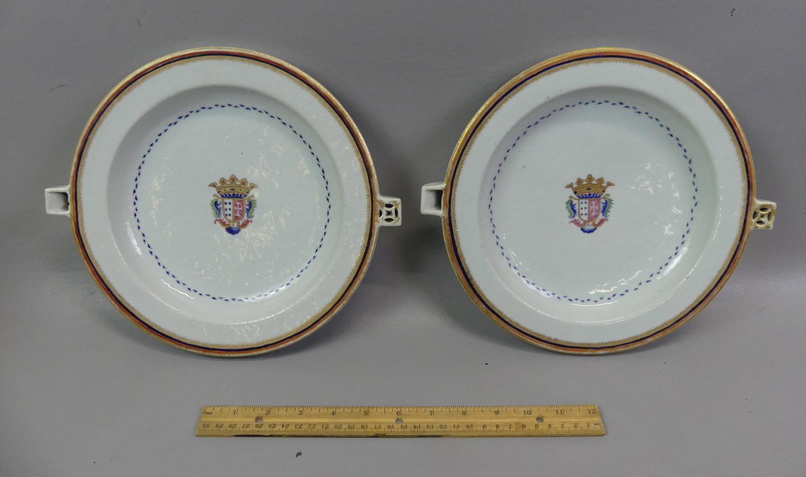 PR. CHINESE 18TH C. ARMORIAL HOT WATER PLATES: Pair of fine 18th century Chinese ceramic armorial hot water plates, 10 in diameter. Both in excellent condition with no flaws.