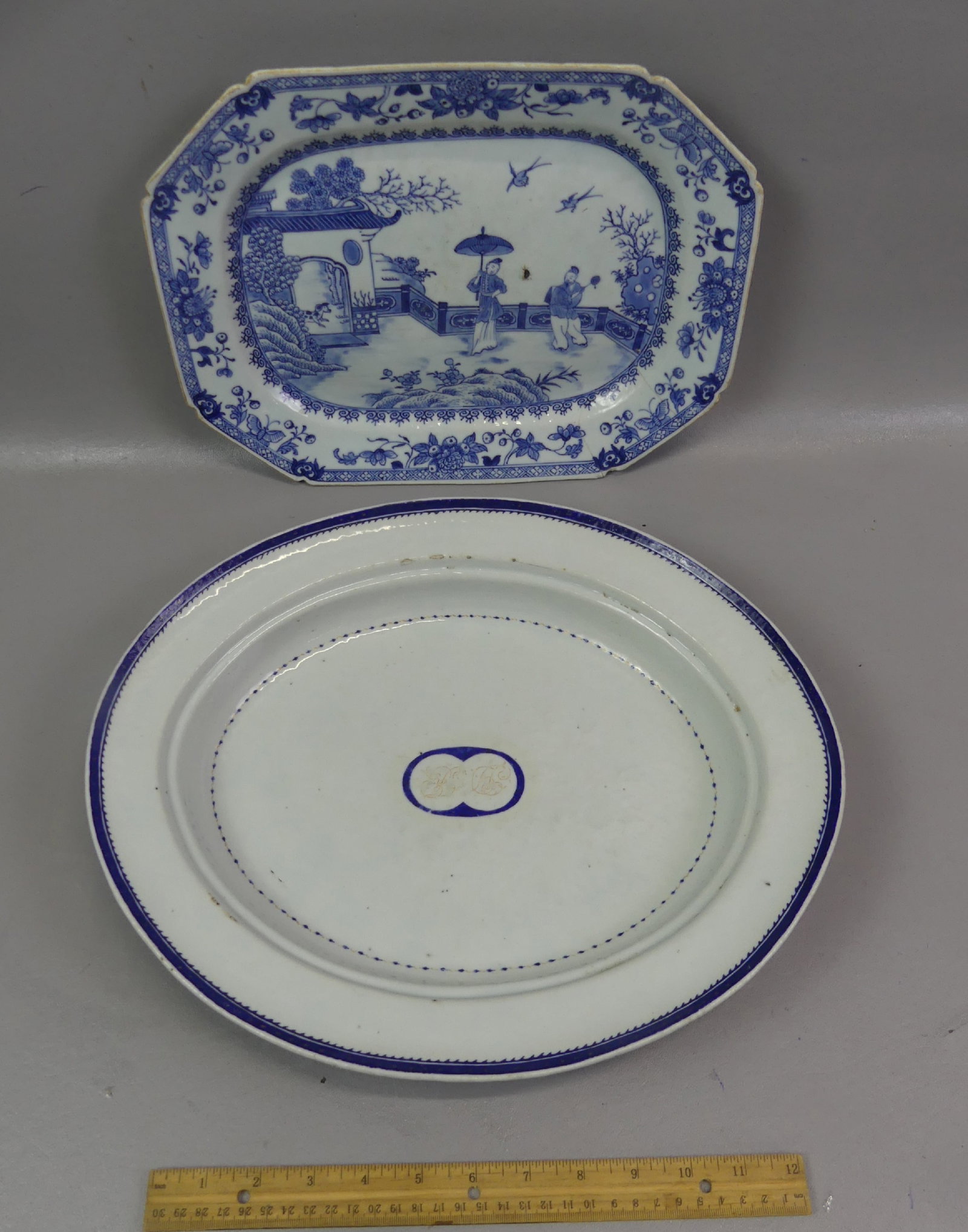 2 QIANLONG CHINESE SERVING PIECES: Lot two 18th century Chinese Qianlong ceramic serving pieces: 15.5 x 2.5 in deep oval cobalt blue bowl (good condition) and 13.5 x 10 in platter with genre scene (agelines/rim chip).