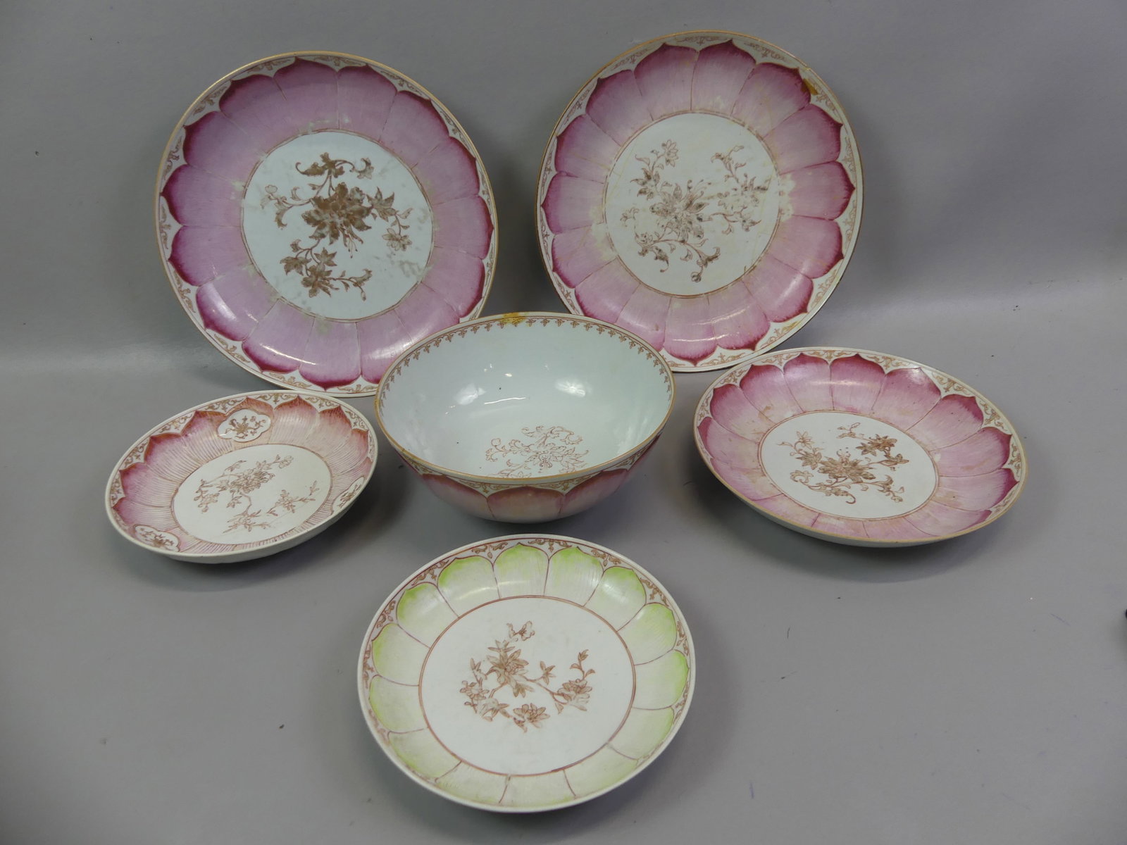6 PIECES 18TH C. CHINESE LOTUS PORCELAIN: Lot of 6 pieces of rare 18th century Chinese Qianlong porcelain, all with painted lotus leaf designs, one light green and others in pink. All have some cracks/wear and includes 9 in bowl; two shallow