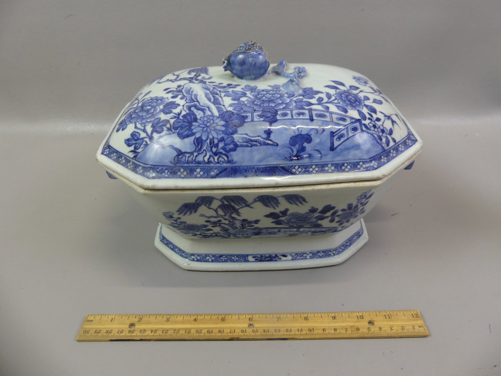 ANTIQUE CHINESE CANTON TUREEN: Early 19th century Chinese Canton covered tureen with scenic designs, pomegranite finial and pierced handles. 12.5 x 8 x 8 inches. Has hairline on cover and couple flakes on finial.