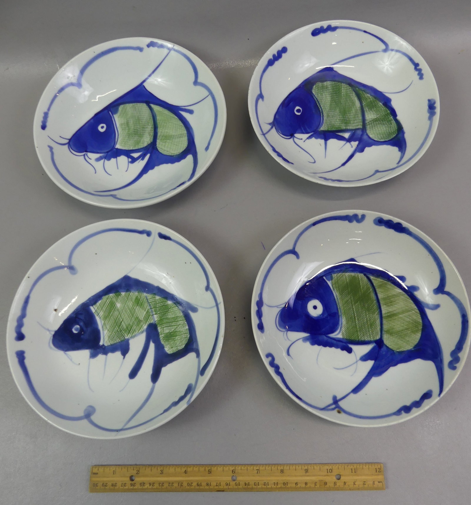 SET 4 CHINESE KOI FISH BOWLS: Set 4 antique Chinese koi fish bowls in blue, green and white. Each has a different mark on back. 9 in diam x 2 in deep. All VG condition.