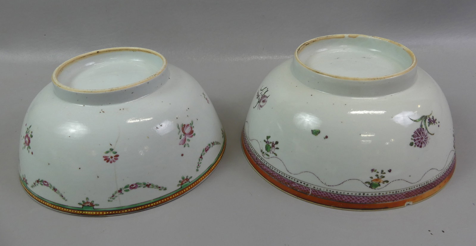 2 CHINESE QIANLONG FRUIT BOWLS: Two 18th century Chinese Qianlong polychromed ceramic fruit bowls: One with roses and swags and beaded rim, 9 x 3.5 in (2 agelines) and scattered floral pattern, 9 x 4 inches (rim chip, one ageline).