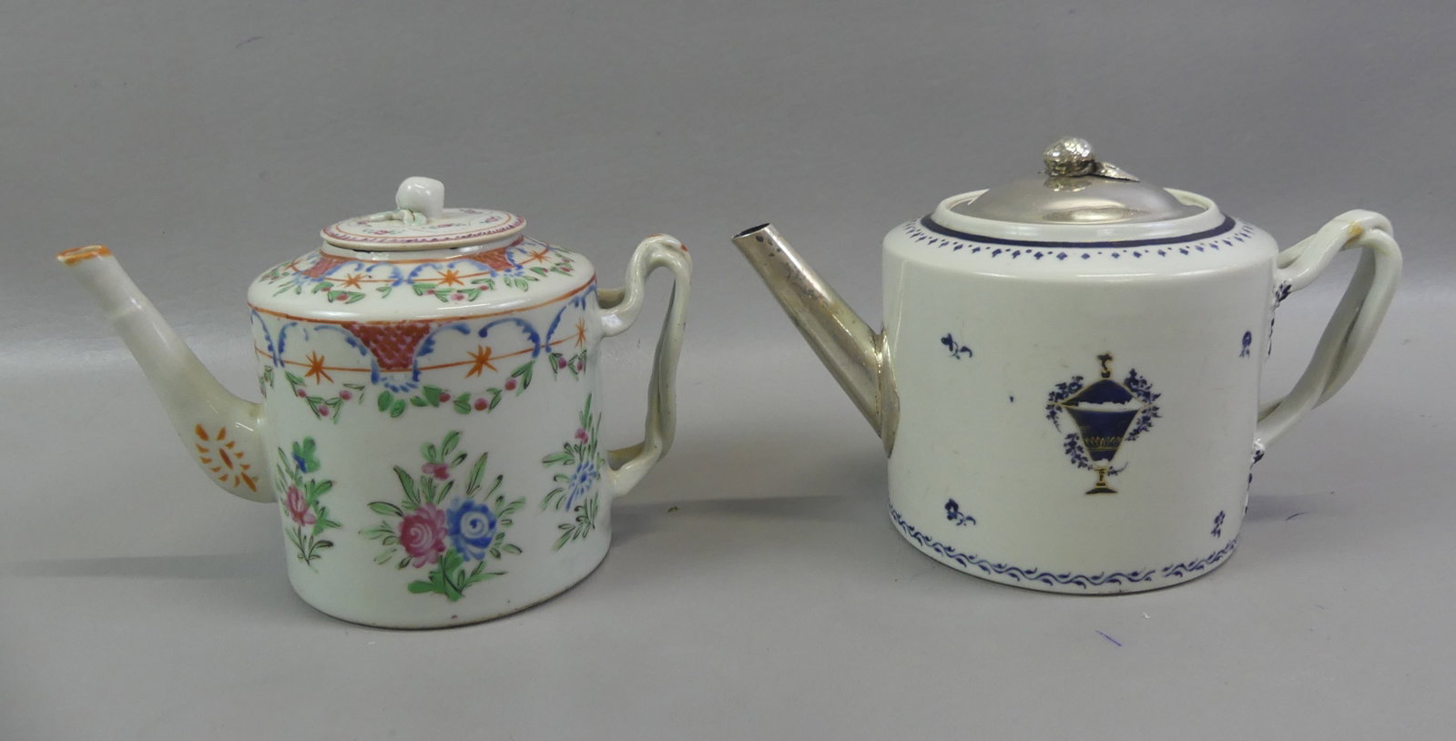 2 CHINESE ANTIQUE DRUM FORM TEAPOTS: Two antique Chinese drum-form ceramic lidded teapots to 5.5 in tall: Ca. 1790 cobalt and gilt decorated with 'make do' silver spout and lid (crack in handle); and circa 1800 with colorful Famille