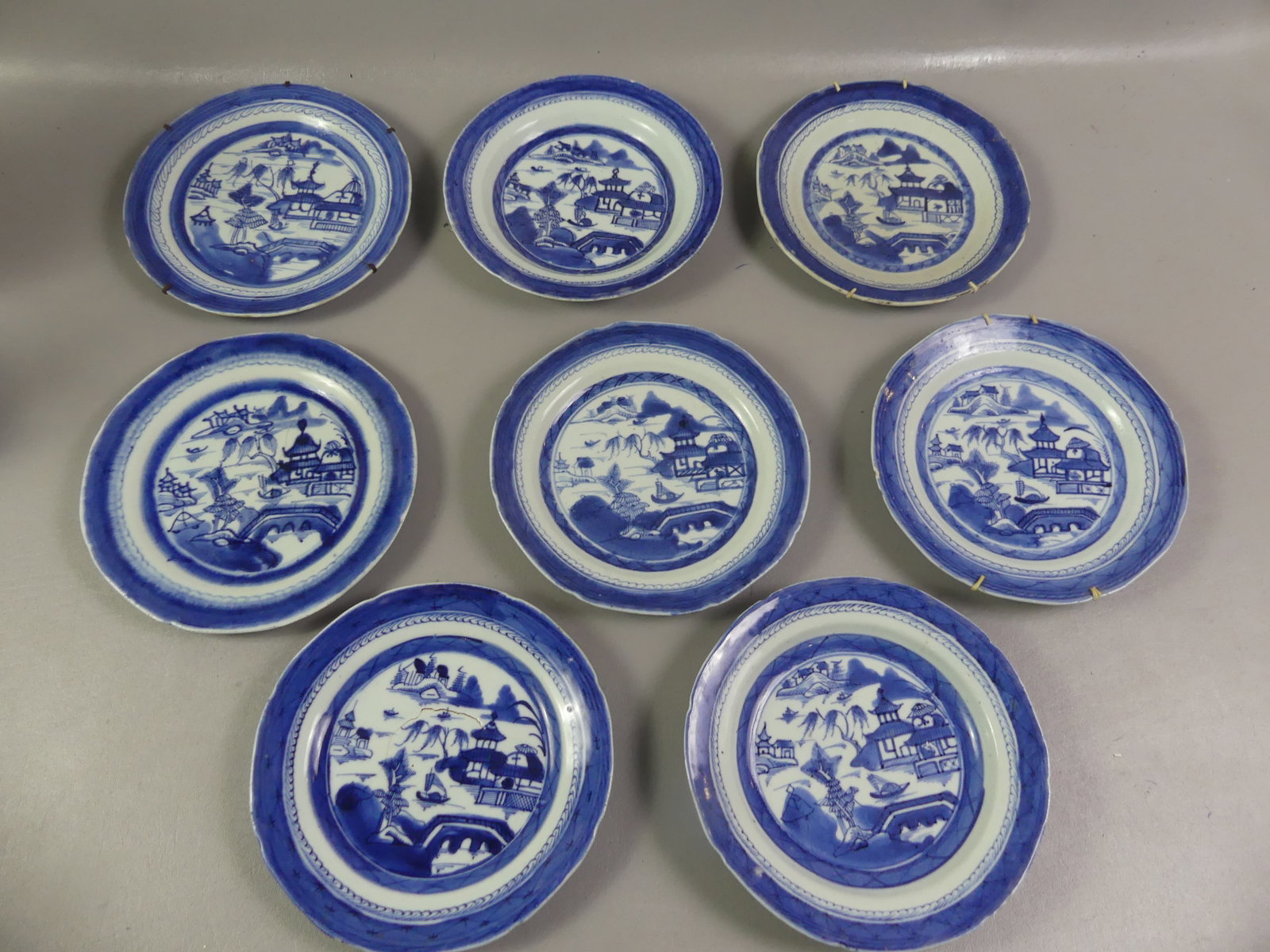8 ASSORTED CHINESE CANTON DINNER PLATES: Lot 8 assorted 19th century Chinese Canton dinner plates from 8.5 to 9 inch diameter. 5 having one ageline, 1 with rim chip.