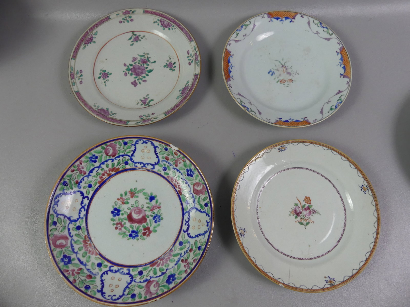 CHINESE QIANLONG PLATES & BOWL: Lot four 18th century Chinese Qianlong items: Floral 9.5 in bowl (rim chip); pink roses plate, 9.75 in (VG); 8.75 in floral plate (good, some wear); and 9 in floral plate with center rose decor (2 age