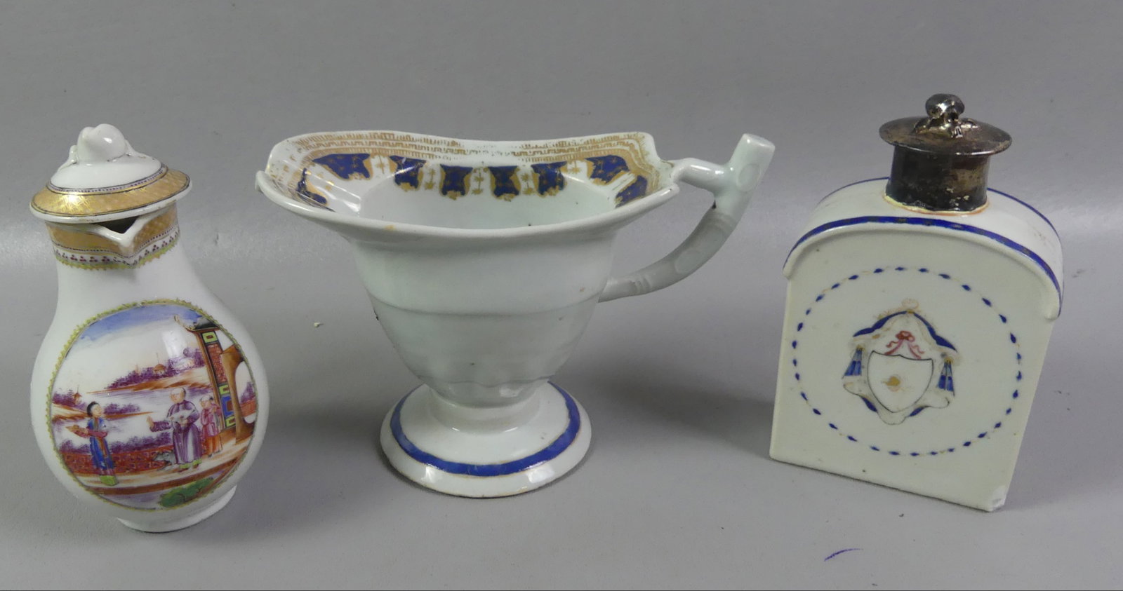 3 CHINESE QIANLONG TEA ITEMS: Group of three 18th century Chinese Qianlong items: 5 in tea caddy with silver lid and collar (rim chip on base); 5.5 in covered creamer with painted genre medallion (VG); helmet-form pitcher with
