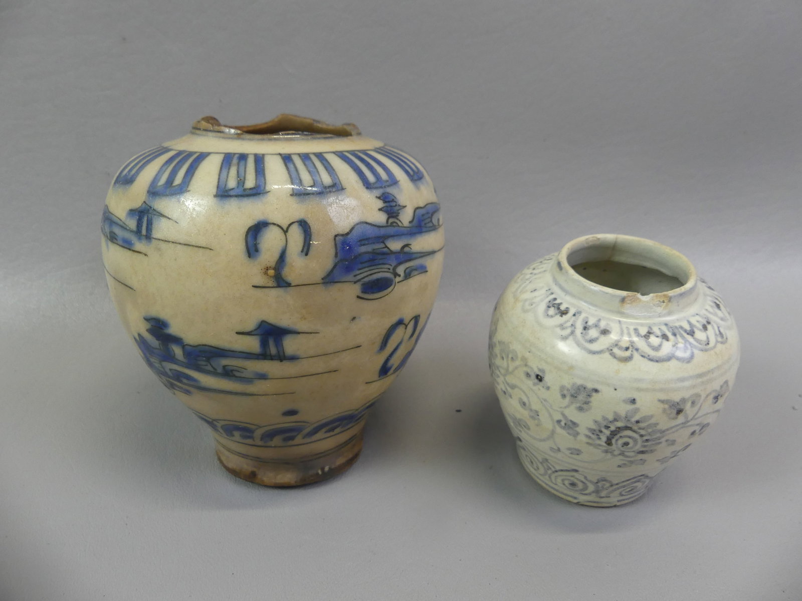 2 EARLY POTTERY VASES: Lot of 2 early pottery vessels: 3 in Vietnamese Annamese jarlet with rim chip; and early Chinese blue scenic vase 4.5 in (damage)