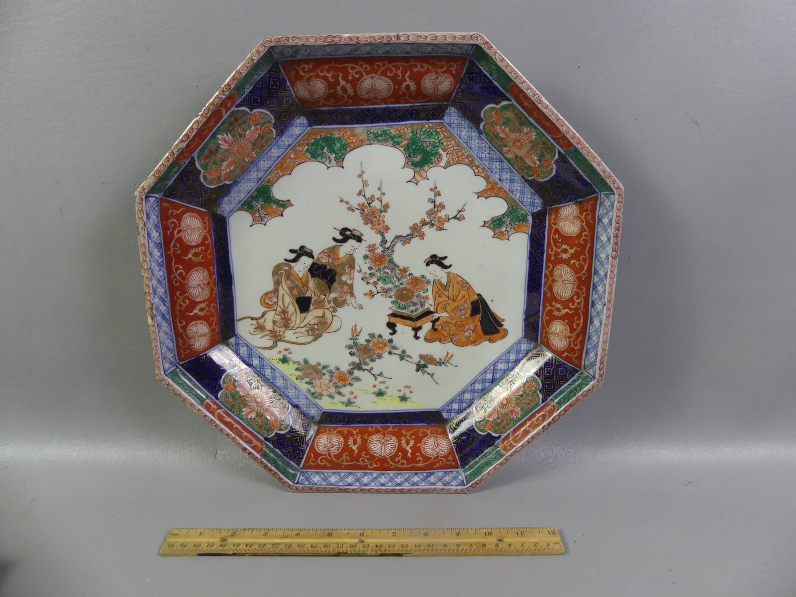 JAPANESE MEIJI IMARI CHARGER: Antique Japanese Meiji period Imari hexagonal charger or platter with 3 geishas in landscape, 15 in diameter, VG condition. Unsigned.