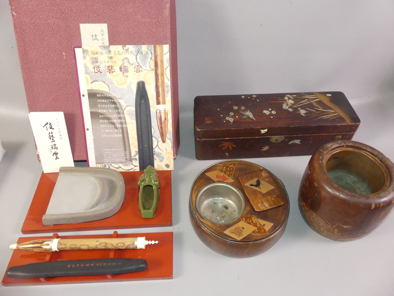 4 JAPANESE ITEMS & BOXES: Lot 4 old Japanese items: Boxed calligraphy set; 8 in round handled tobacco tray with enamel designs; 6.5 in pot with gilt and inlaid designs; and 16 in wood glove box with abalone inlaid birds and fl
