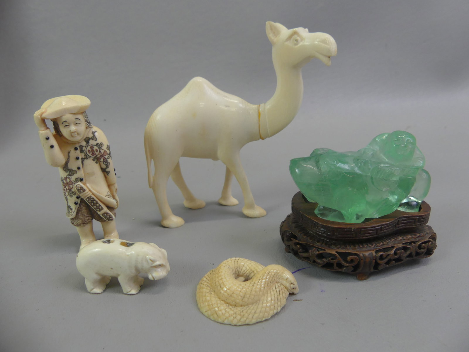 7 ITEMS INCL. JAPANESE NETSUKES: Lot of 7 mostly Japanese items including 3 netsukes - organic rhino, organic coiled snake, 1.5 in; 3 in of man (chip on hat); 4 in camel; and 2.5 in green fluorite gemstone man on frog (wood base).