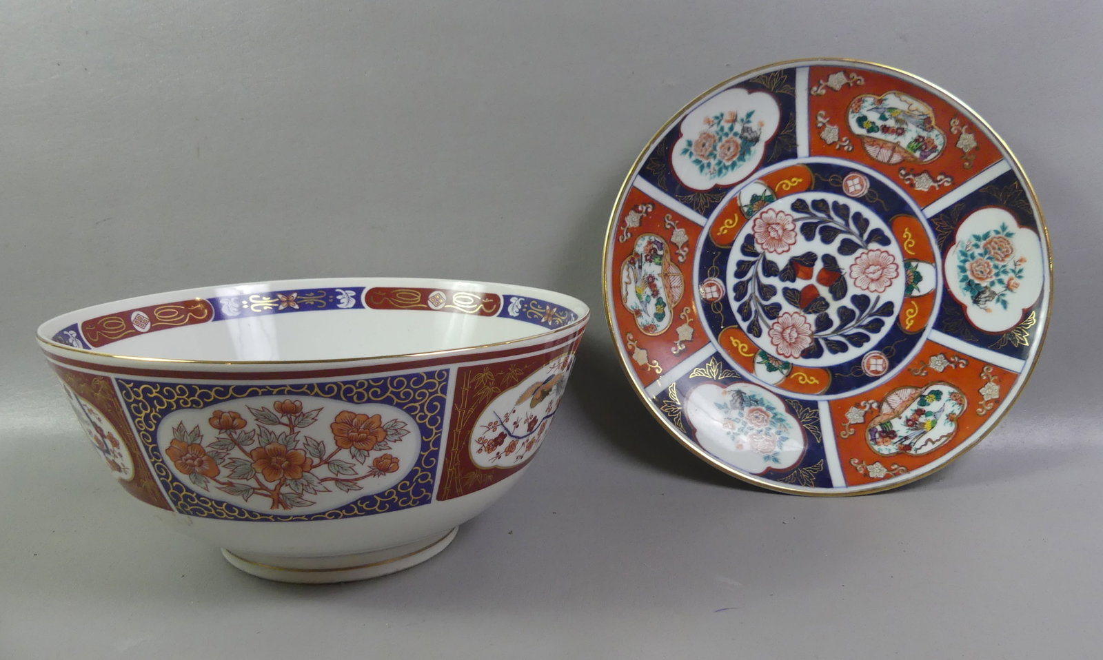 2 JAPANESE IMARI ITEMS: BOWL & CHARGER: Two old Japanese Imari items: 12 in porcelain charger, signed; and 12 x 5 inch bowl, unsigned. Both VG condition.