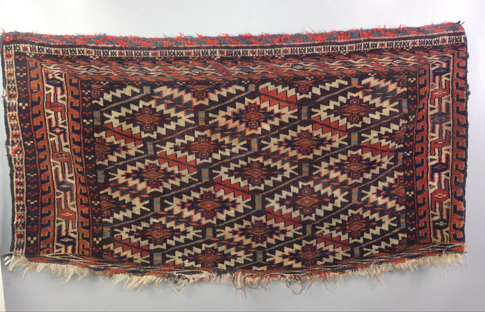 ANTIQUE TURKOMAN ASMALYK RUG: Antique Turkoman Asmalyk scatter rug 2 ft x 3 ft 8 inches. Has some edge loss, otherwise good condition.