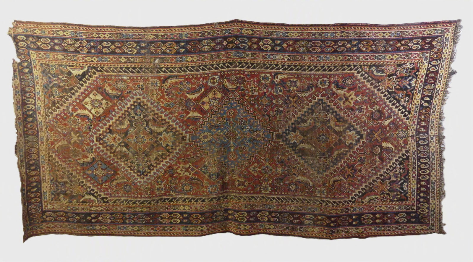 ANTIQUE QASHQAI RUNNER RUG: Antique Qashqai hall runner with triple medallion, 3 ft 9 in x 7 ft 4 in. Has some wear, hole and damage to end.