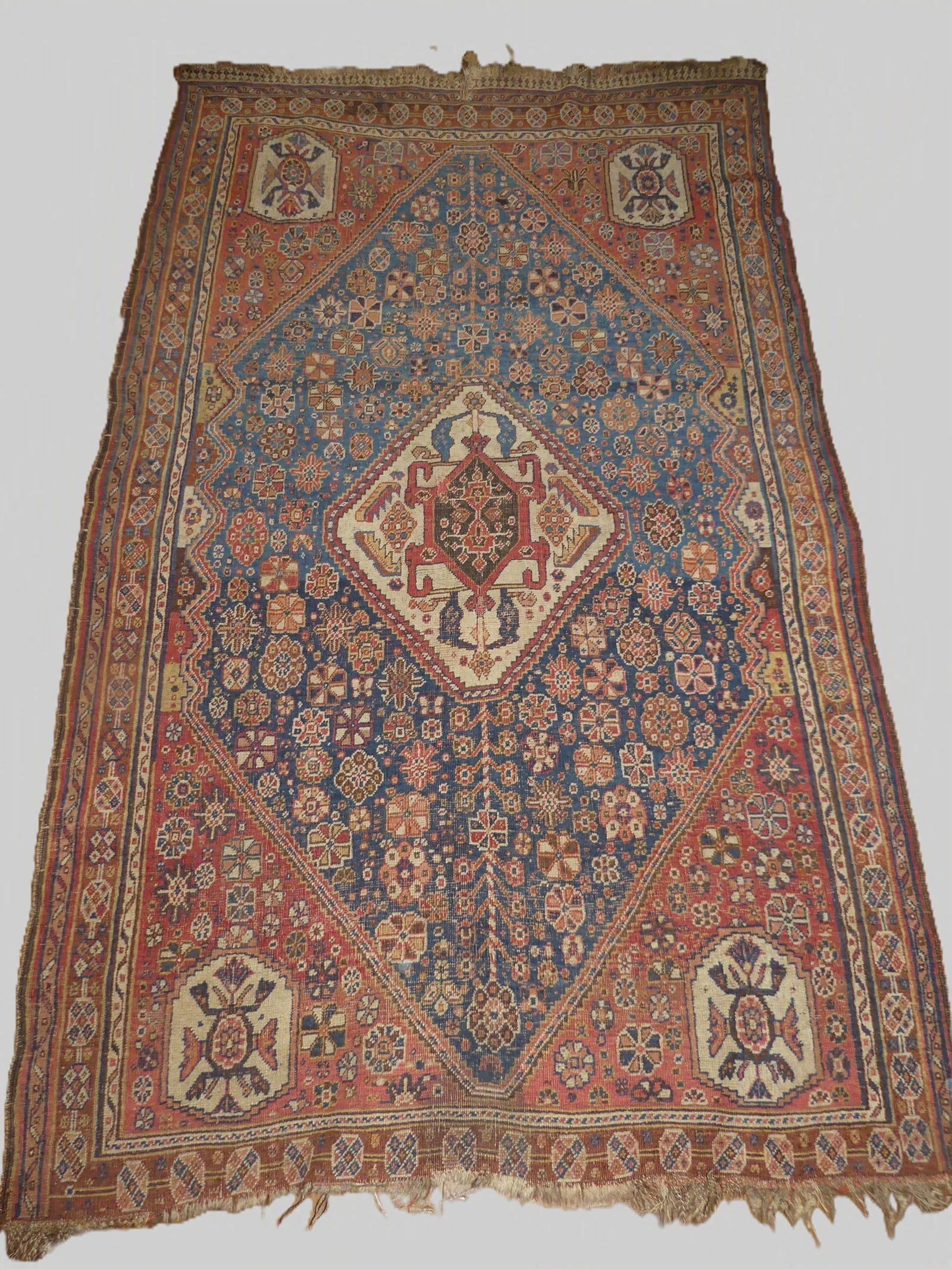 ANTIQUE QASHQAI RUG: Antique Khamseh or Qashqai large scatter rug, 4 ft 4 in x 7 ft. Even pile wear, minor loss to ends.