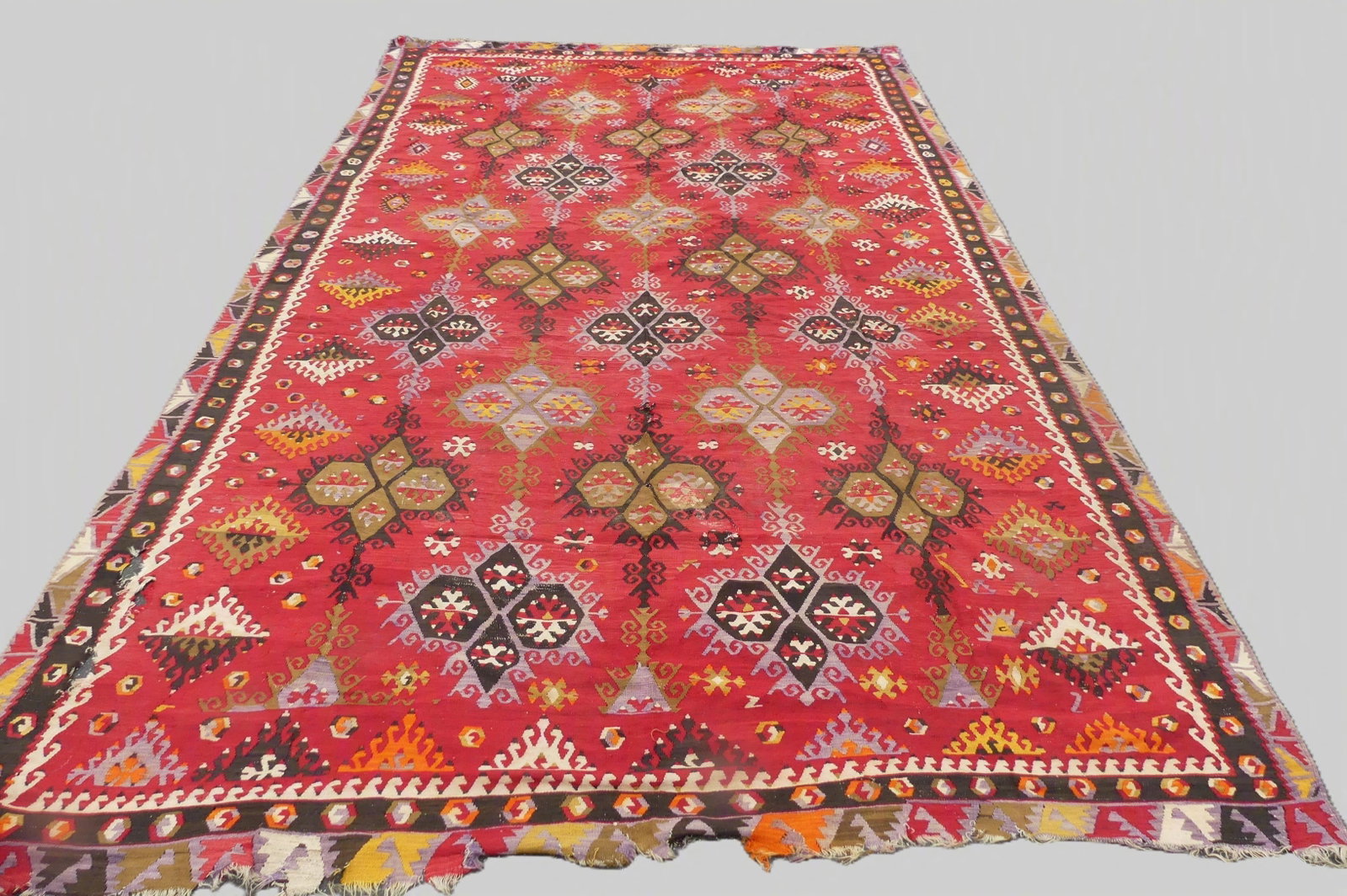 ANTIQUE KILIM ROOM SIZE RUG: Antique flat weave Turkish Kilim room size rug in red with field of ornamental boxes. 8 ft x 13 ft 3 inches. Has 3-4 small holes, some loss to ends.