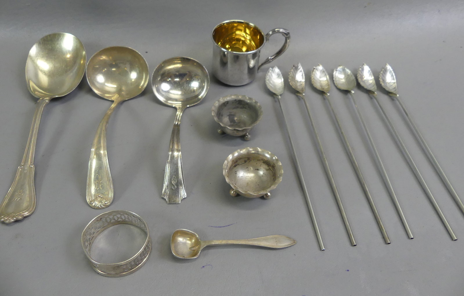 STERLING LOT W/TIFFANY SPOONS: Lot of sterling silver including set of 6 Tiffany straw spoons with leaf-form bowl (original felt bags); cup; 2 ladles, 2 salt cellars, etc. Total 11.52 ozt.