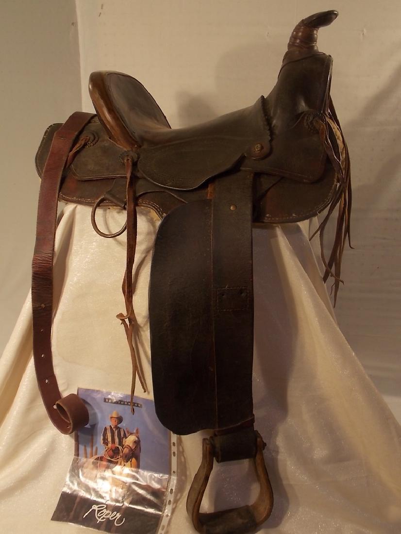 OLD LICHTENBERGER WESTERN SADDLE FROM MOVIES: Old leather western saddle used in several movies and television shows including Bonanza, owned by Ben Johnson Entertainment Co (comes with Ben Miller of AZ signed letter as shown). Saddle is stamped