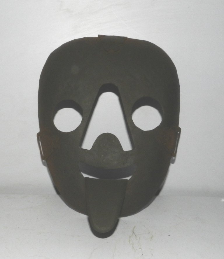 OLD MASK IRON TORTURE SHAME HUMILIATE LONG TONGUE: Old iron mask with long tongue, such were used in older century to punish person who does anything wrong in society. It was made wear to person who do bad / wrong in society and tie on tree or pole wh