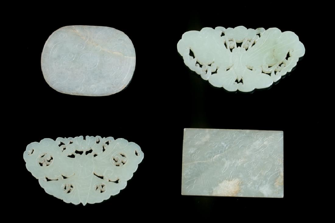 A GROUP OF FOUR JADE PENDANTS (1 of 5)
