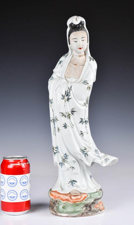A Painted GuanYin Statue: A famille rose Guanyin in standing status, bamboo painting on her robe, H: 43.5cm 粉彩觀音立像 Condition report upon request. Prospective buyers should inspect each