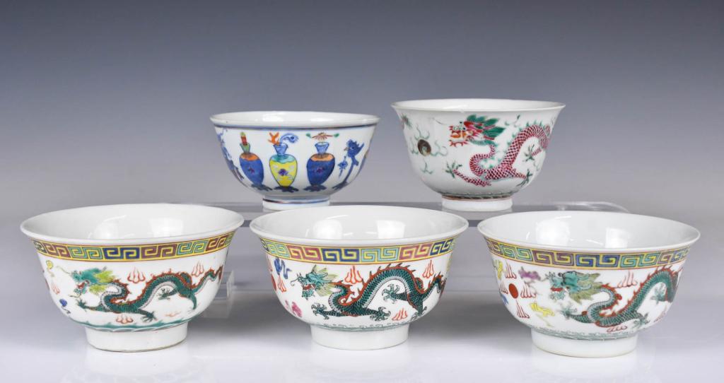 A Group of Five Famille Rose Bowls Republican Peri: Three of them are in the same style, exterior and center painted with dragons, with four characters Qianlong mark at the bottom; One with two red dragons painted at the exterior and six characters Qia