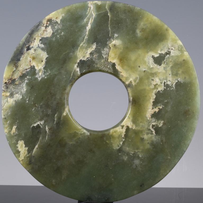 A Chinese Green Jade Bi Disc: Size: 12.5cm wide x 5mm thick. Weight 164 grams. See: Sotheby抯 New York, Important Chinese Works of Art, Sept 11th, 2019 lot 811. https://www.sothebys.com/en/auctions/ecatalogue/20 19/important