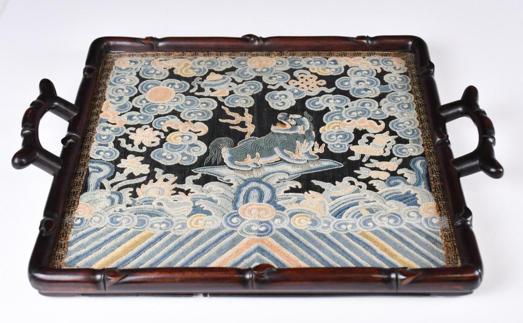 A Hardwood Tray Decorated w/Silk Embroidery Military Badge: The borders worked as bamboo shapes, with a military embroidery badge of a mythical beast framed as the center with a glass top. 38.5x 32.2cm 硬木刻竹紋鑲補&#