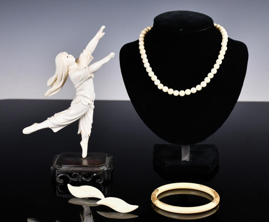 A Group of 4 Bone Carved Ornaments: The group comprised of a bone carved ornament of a dancing girl and three bone carved accessories. Ornament H: 20.5cm, Bngle D: 8.4cm 骨雕擺件及首飾一&#