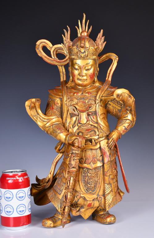 A Wood Carved Weituo Statue Qing: The guardian deity standing, standing with one foot thrust forward, his left arm at held backwards at waist level and his right arm posed to hold a sceptre-shaped weapon, wearing an elaborate chainmai