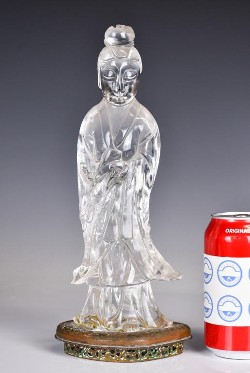 A Crystal Figure Sculpture w/ Stand 19thC: Standing with an elegant sway, wearing long layered robes and holding a scroll in her hands, the face with eyes downcast in a serene expression, the stone of very clear clarity. H: 28.7cm 19世&#