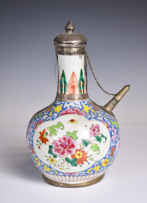 A Silver Mounted Famille Rose Ewer 18thC Export: A silver inlaid famille rose ewer, with a globular body attach with a spout and a lid, overall painted with floral patterns, L: 18.4cm H: 25cm Provenance: H.H. Pao's previous collection 18世 
