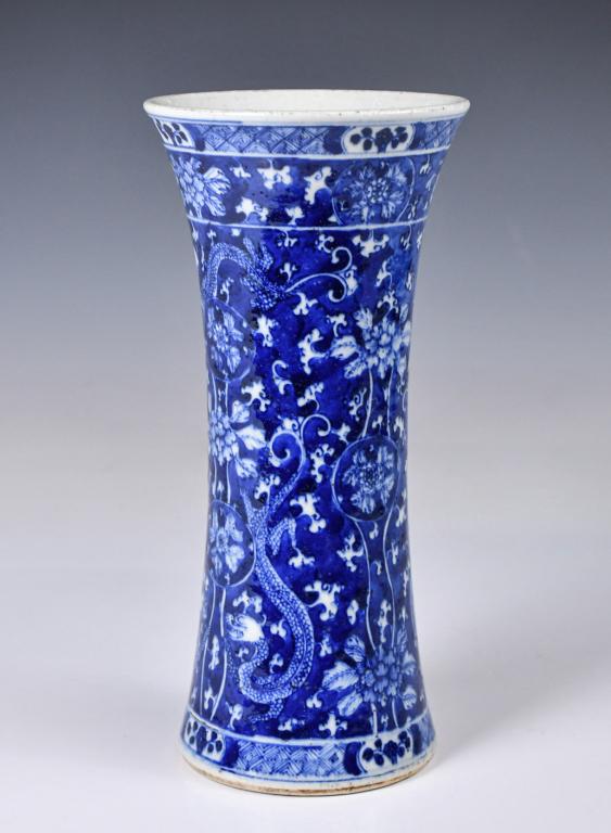 A Blue & White Chi Dragon Vase Qing: Of classic Gu form, this porcelain vase's exterior decorated in rich blue tones with Chi dragons and floral patterns, H:24.8cm 清 青花地螭龍紋花觚