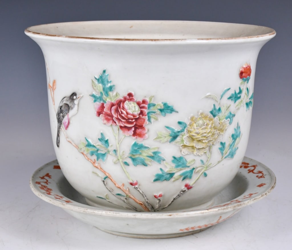 Famille Rose Relief-Decorated Planter&Saucer 19thC: Supported on short round feet, with elegantly carved with a cartouche inlaid to the exterior, comes with a plate with a mark to the bottom. D: 26cm x H: 18.7cm Provenance: Estate of A Hong Kong Family