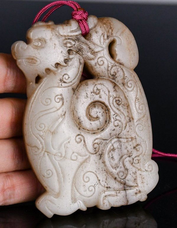 A White Jade Carved Dragon Plaque Qing (1 of 9)