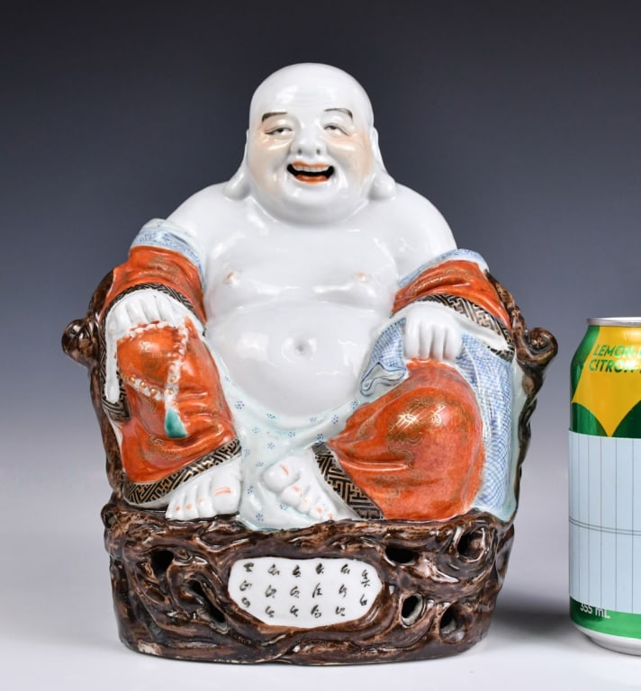 A Famille Rose Buddha Statue w/Maker's Mks Republi: Depicted a Buddha sitting and wearing orange and blue robes, inscription at the front and back, with two marks at the bottom, H: 22.8cm 民國 粉彩多子笑佛