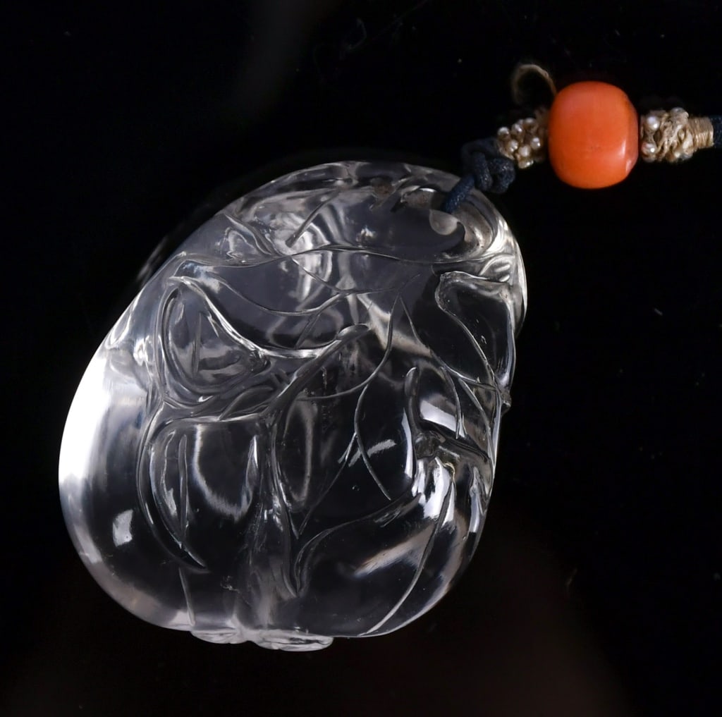 A White Crystal Melon Carving Qing: Worked as a large melon borne on curling tendrils issuing smaller melon on a gnarled branch issuing leafy curling tendrils, L:4.2cm 清 白水晶雕瓜瓞綿