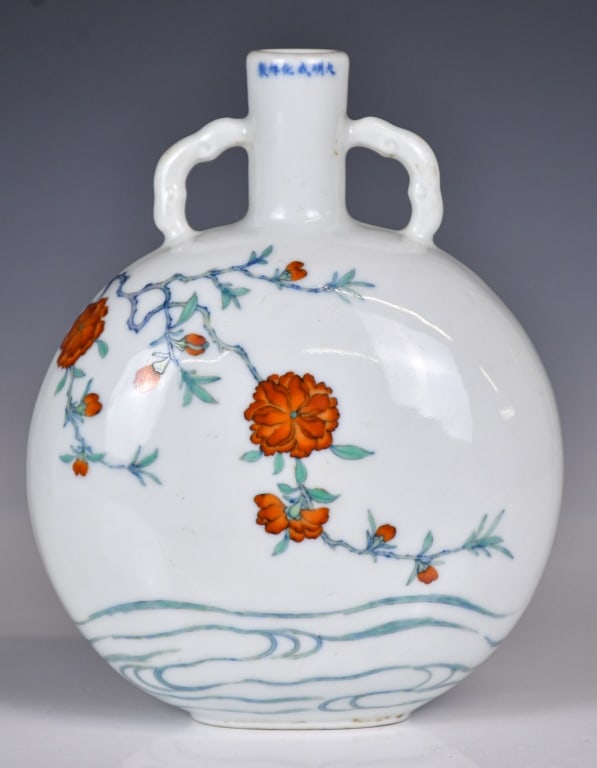A Doucai Moon Flask Vase Chenghua Mk Qing: Of typical moon flask vase form, painted on the exterior with flower motifs, then marked around the mouth rim with a six-character Chenghua mark. H: 18.8cm 清 斗彩花卉