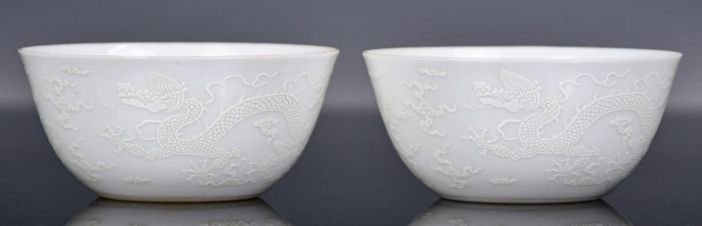 Pair of White-Glazed Dragon Cups Chenghua Mk: Of globular body, decorated with white dragons, six-character Chenghua mark at the bottom, D: 8.4cm x2 薄胎龍紋小茶盞對 大明成化