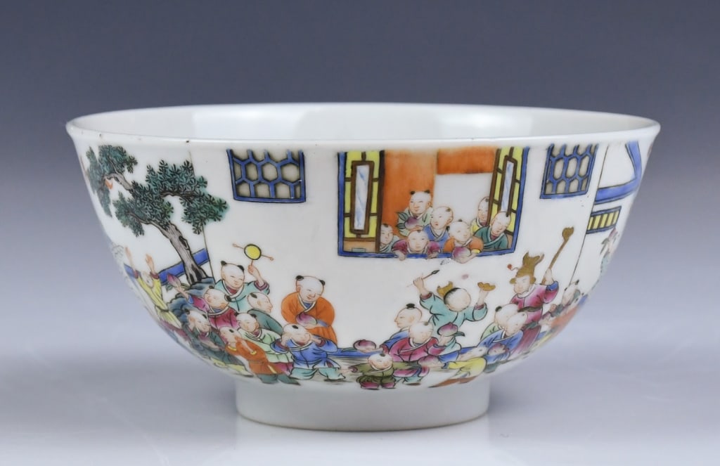 A Famille Rose Boys Bowl w/JiaQing Mk: The exterior body painted with continuous boys playing in garden scene, six-character JiaQing mark at the base. D: 11.2 x H: 6cm 粉彩嬰戲圖小碗 大଀
