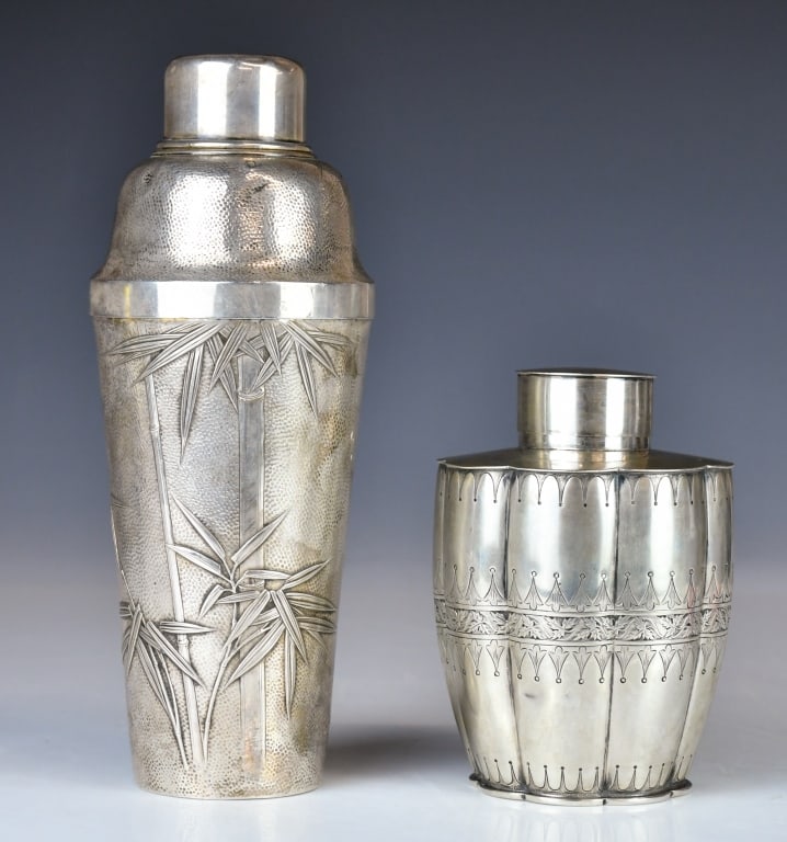 Group of 2 Silver Wares: Comprising a cocktail shaker and a tea caddy. The cocktail shaker is engraved with bamboo motifs, while the tea caddy is of lobed form. Largest H: 22.7cm, approx total weight:680g 