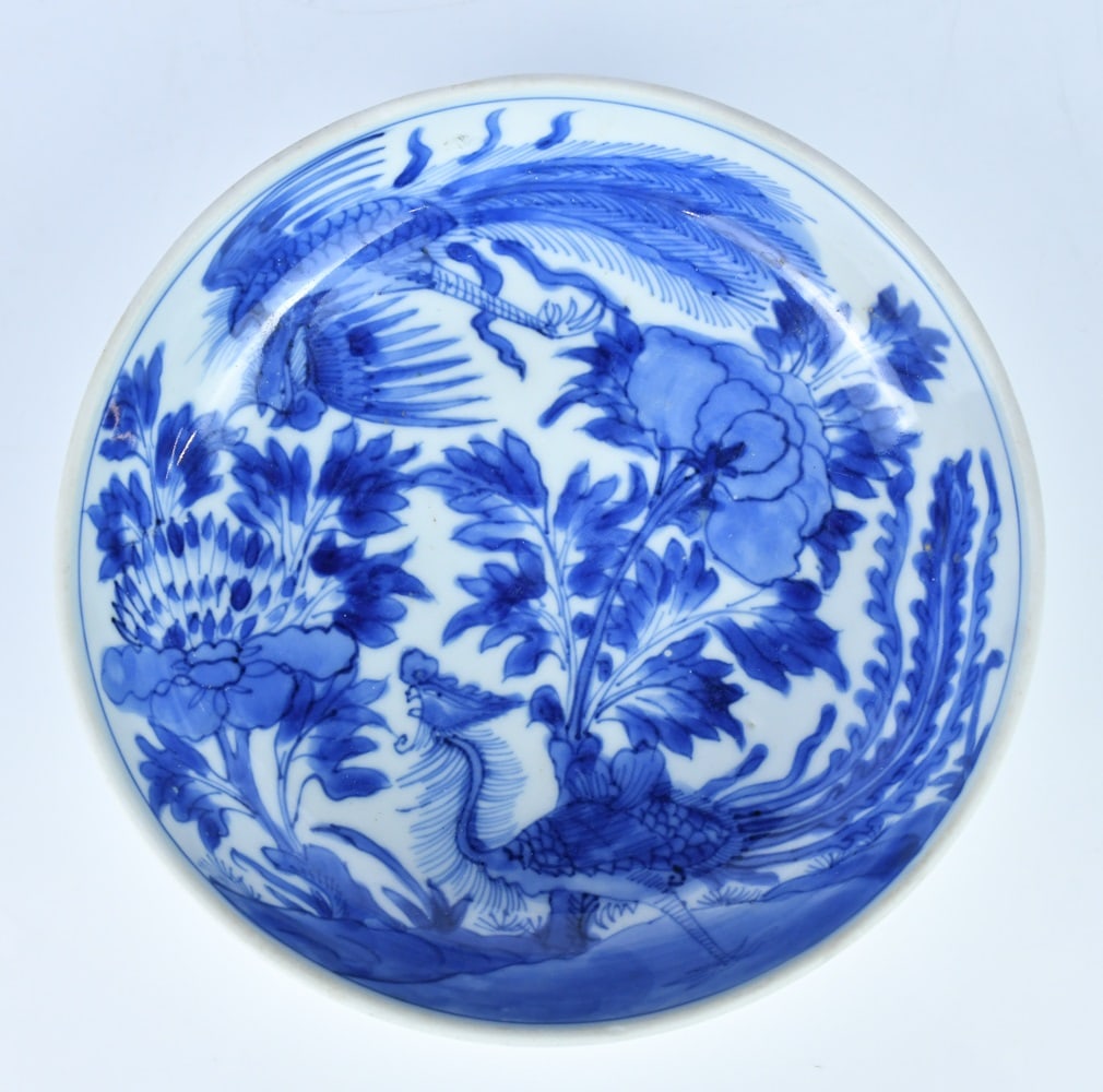 A Blue & White Phoenix & Peony Dish w/Mk Qing: The interior painted with two phoenix in peony garden scene, six-character mark at the bottom, D:15.5cm 清 青花鳳凰牡丹紋盤 帶款