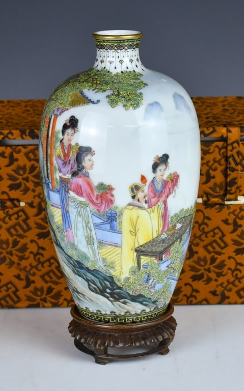 A Famille Rose Vase w/Mk w/Std w/Box Republican: Of ovoid form rising to a waisted neck, painted with a continuous courtyard scene of figures, the neck and foot with geometric decorative borders, Yanghetang mark at the bottom, comes with a wood stan
