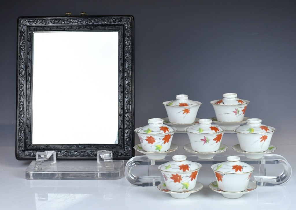 A Rosewood Mirror & Set of 7 Teacups Republican: Comprising seven gaiwans, each with a domed cover and saucer, the exterior decorated with scattered maple leaves, each has a mark at the base, H: 8.2cm; together with a mirror framed with Suanzhi, 34.