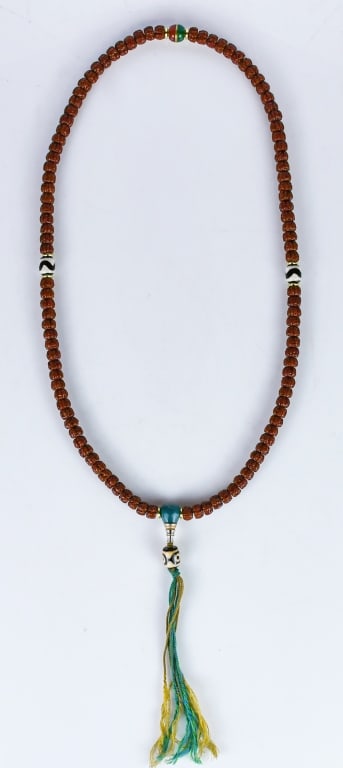 A Bodhi Seed Necklace: A Bodhi seed bead necklace with decorative accent beads, including some with a black and white striped pattern and a prominent turquoise or green bead located near the bottom. L:46cm 