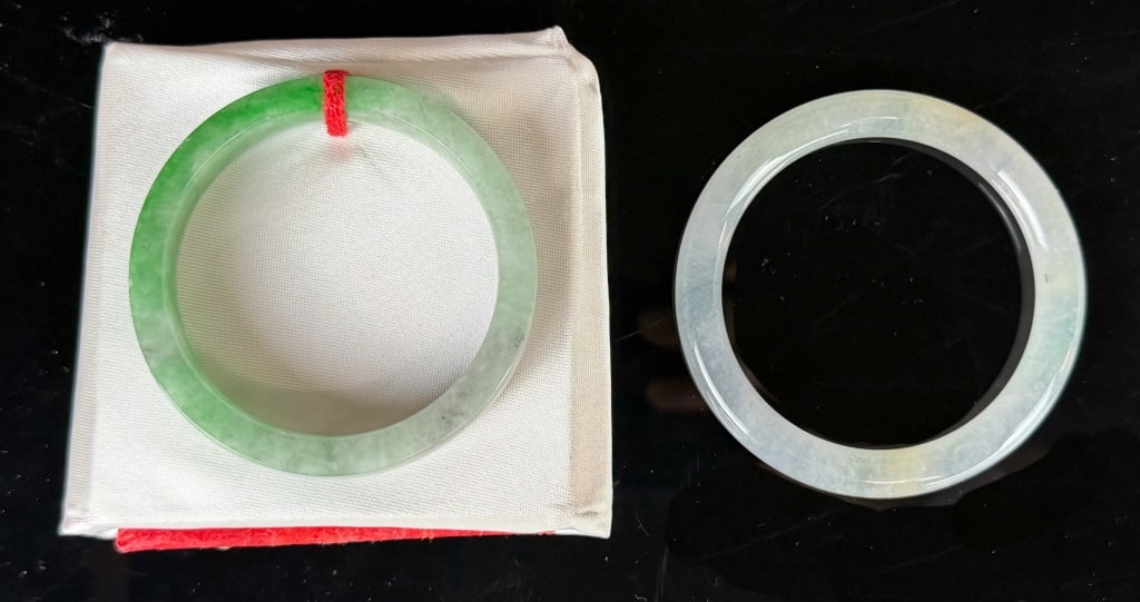 1 Square Jadeite Bangle & 1 Round Jadeite Bangle: The square one with large part of green splash, and some grey and russet inclusions, 49x11x6.6mm; the round one is semi-transparent with a slightly yellowish-green base color, 53x7.8x7.8mm 翡